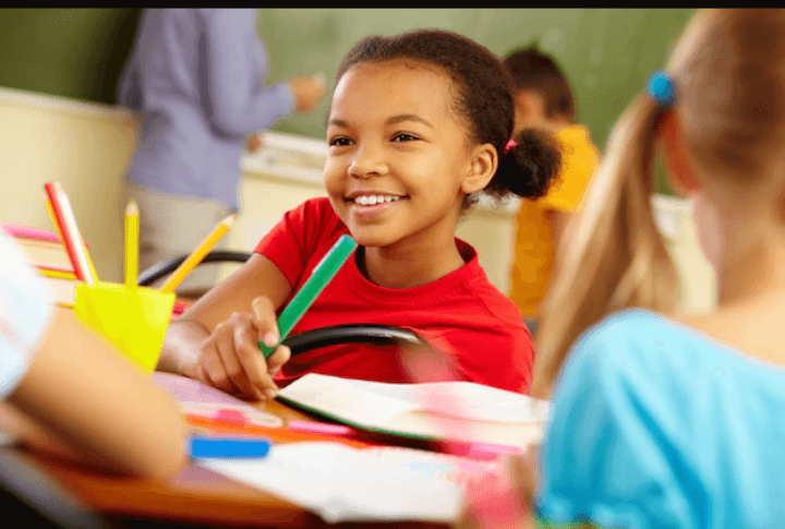 Thoughtful little girl holding a highlighter